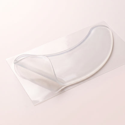 Clear reusable silicone neck patch on its backing