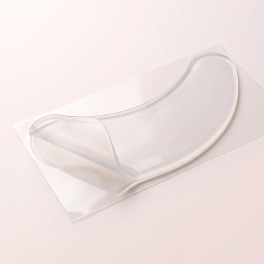 Clear reusable silicone neck patch on its backing